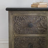 Close-up of an antique metal two-drawer bedside table with a black granite top 2