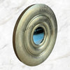 Close-up of an Apollo hammered brass gold mirror with intricate detailing 5